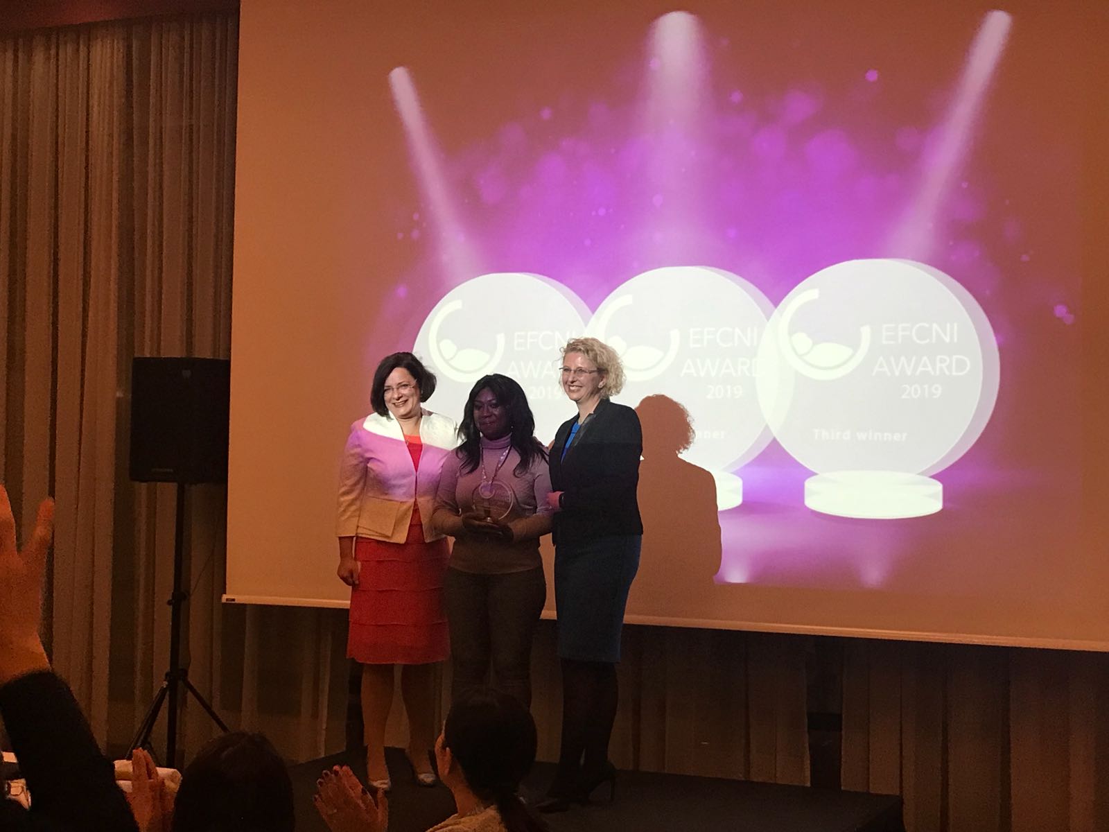 Selina Bentoom receiving the EFCNI Award