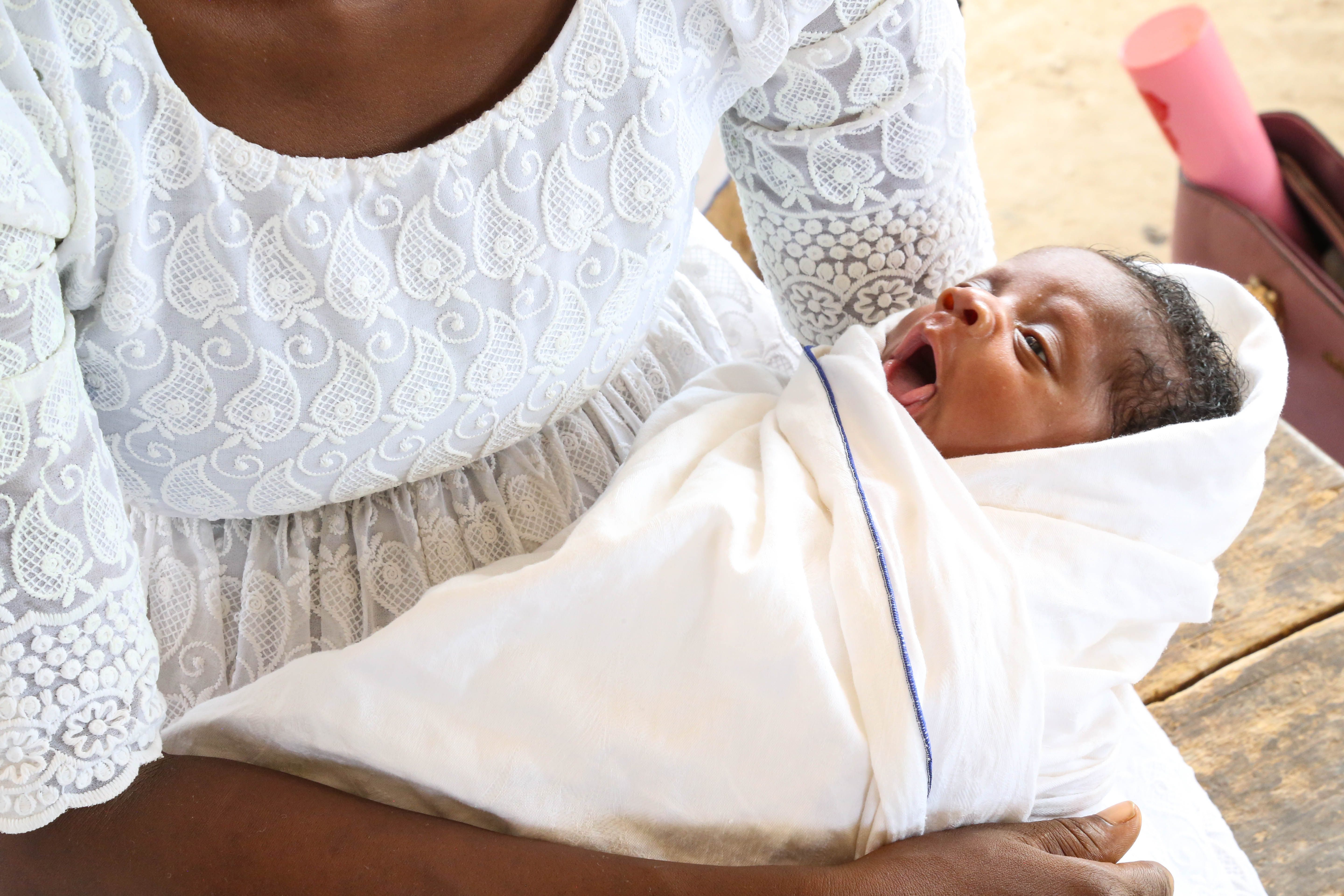 A newborn wrapped in AFPNC support