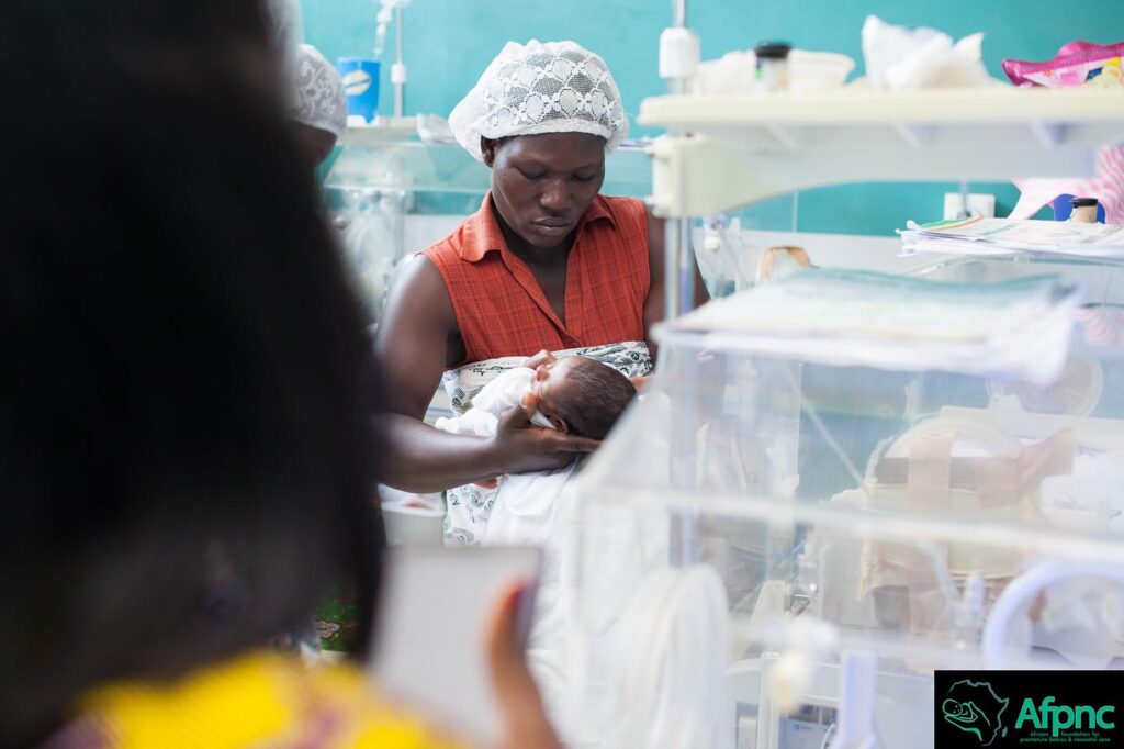 Mother caring for her preterm baby